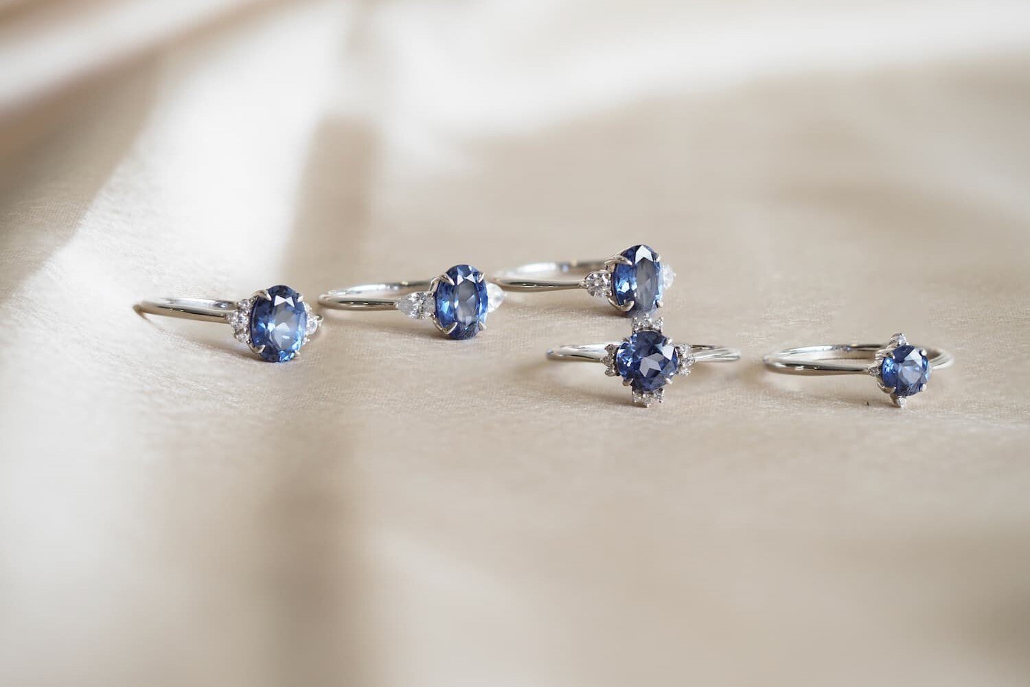 Blue sapphire engagement rings on velvet cloth