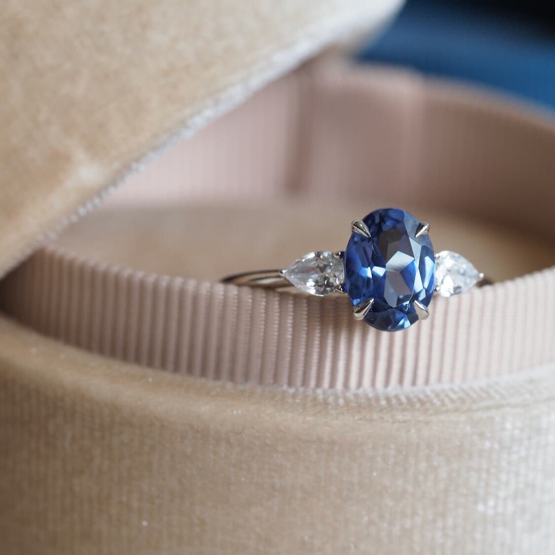 Oval blue sapphire ring kept in velvet bix
