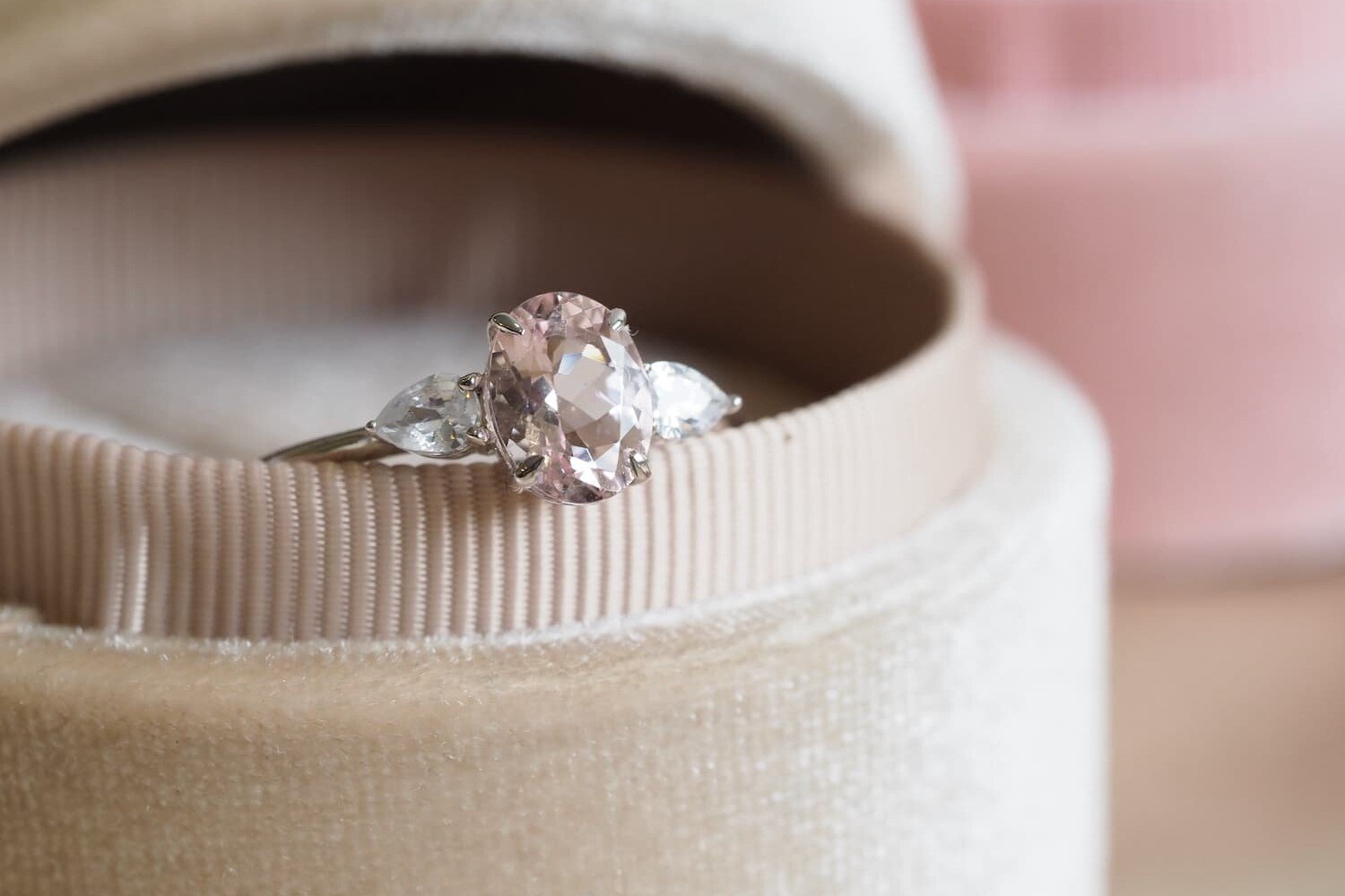 Lisa Morganite engagement rings with pear diamonds in velvet box