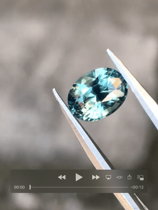 Teal Sapphire engagement ring - stone video grab