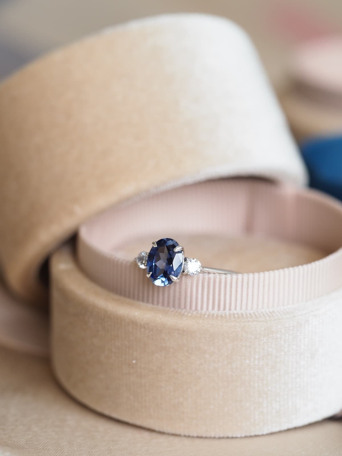 Rectangular sapphire blue stone ring lined with cz -