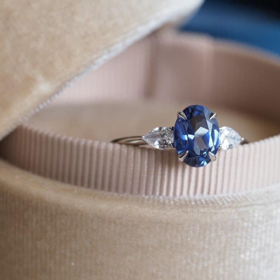 Minimalistic blue sapphire ring with diamonds