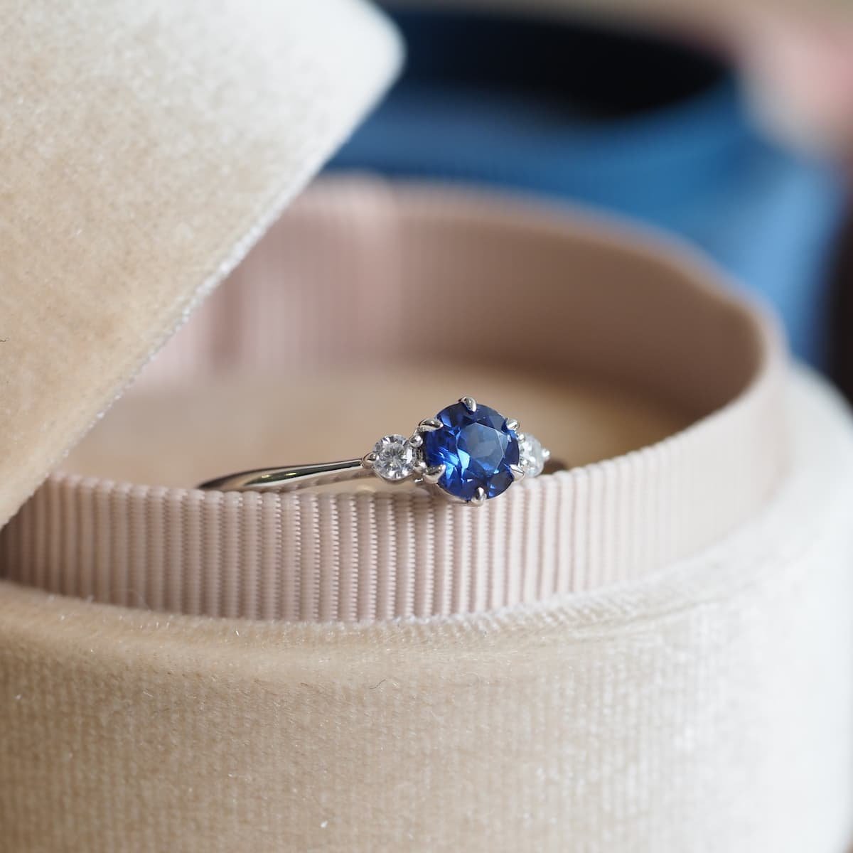 Diamond And Blue Sapphire Swirl Ring In Platinum