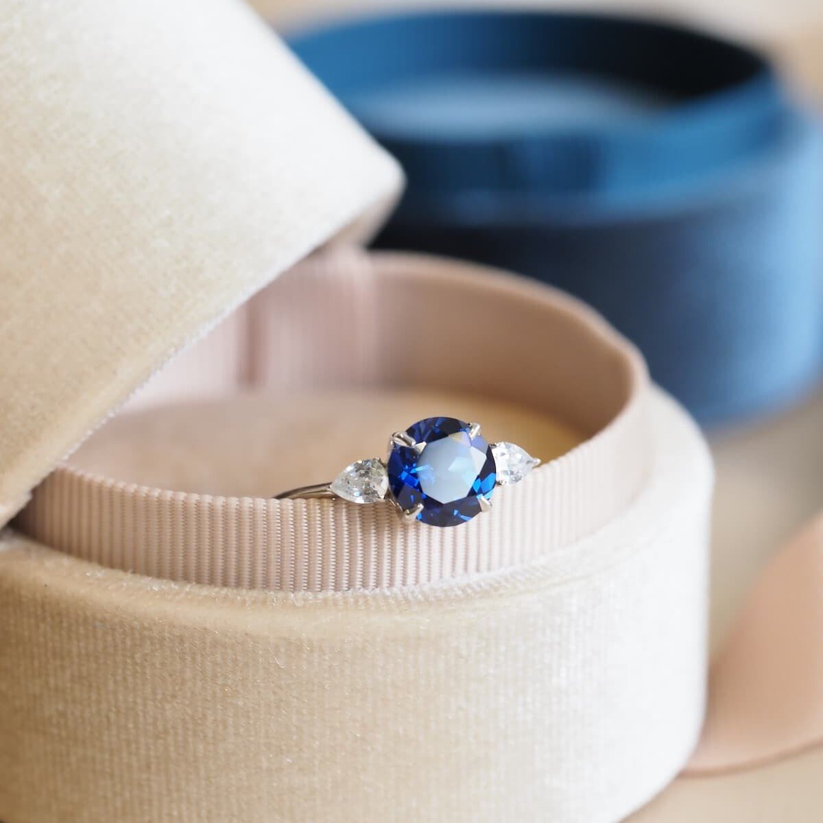 Sapphire ring with pear diamonds on side